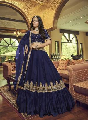 For A Designer Look,Grab These Lehenga Choli in Fine Colored.These Lehenga Are Lino Sil & Nylon Satin And Blouse Are Fabricated On Lino Silk Pair With Heavy Nylon Net Dupatta.Its Beautified With Designer Jari,Sequance Embroidery,Hand Work.