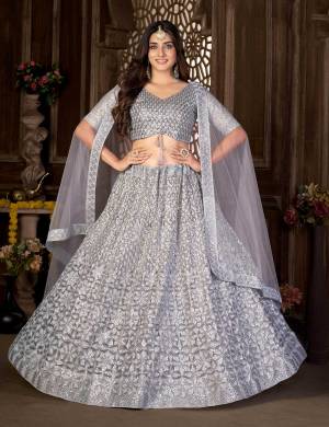 Grab These Beautiful Colored Lehenga Choli.These Lehenga and Blouse Are Fabricated On Net Pair With Net Dupatta.Its Beautified With Heavy Thread,Sequance Embroidery Work.