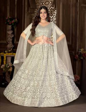 Grab These Beautiful Colored Lehenga Choli.These Lehenga and Blouse Are Fabricated On Net Pair With Net Dupatta.Its Beautified With Heavy Thread,Sequance Embroidery Work.