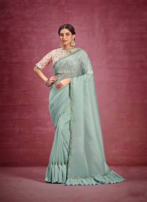 Look Attrective These Party Wear Saree in Fine Colored.These Saree Are Net Organza And Blouse  is Fabricated On Raw Silk.Its Beautified With Heavy Designer Fancy Work.