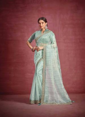 Look Attrective These Party Wear Saree in Fine Colored.These Saree Are Patterned Jacquard Organza And Blouse  is Fabricated On Raw Silk,Net.Its Beautified With Heavy Designer  Embroidery Work.