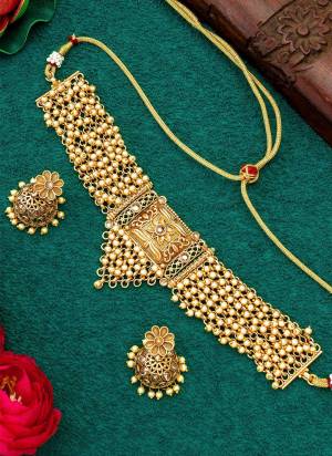 Grab These Beautifil Gold Colored Necklace.These Necklace is Come Copper Material And Beautified With Temple Work.