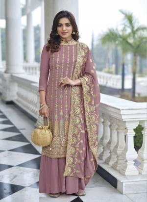 Attrective These Sharara Suit in Fine Colored Pair With Bottom And Dupatta.These Top And Dupatta Are Fabricated On Faux Georgette Pair With Santoon Bottom.Its Beautified With Santoon Inner.Its Beautified With Heavy Designer Multy Thread Embroidery Work.