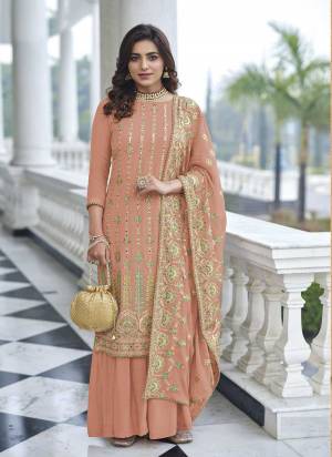 Attrective These Sharara Suit in Fine Colored Pair With Bottom And Dupatta.These Top And Dupatta Are Fabricated On Faux Georgette Pair With Santoon Bottom.Its Beautified With Santoon Inner.Its Beautified With Heavy Designer Multy Thread Embroidery Work.