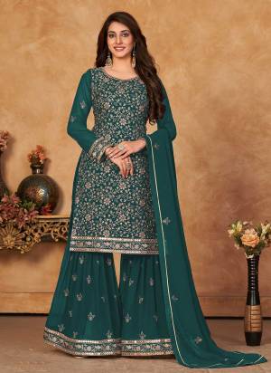 Grab These Designer Sharara Suit in Fine Colored Pair With Bottom And Dupatta.These Top And Dupatta Are Fabricated On Faux Georgette Pair With Santoon Bottom.Its Beautified With Santoon Inner.Its Beautified With Heavy Designer Jari,Sequance Embroidery Work.