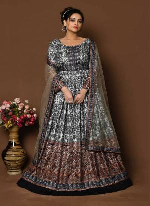 For A Designer Look,Grab These Readymade Gown With Dupatta in Fine Colored.These Gown Are Fabricated On Dola Silk Pair With Net Dupatta.Its Beautified With Designer Digital Printed With Sequance Embroidery Work.