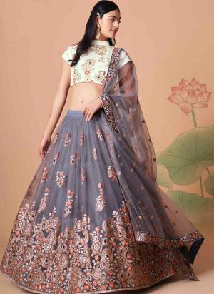 For A Designer Look,Grab These Lehenga Choli in Fine Colored.These Lehenga And Dupatta Are Fabricated On Soft Net Pair With Art Silk Blouse.Its Beautified With Designer Thread,Mirror,Dori,Sequance Embroidery Work.