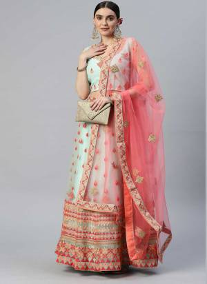 Heavy Designer Lehenga Choli In White and Baby Pink Color Fabricated On Net Beautified With Heavy Attractive Embroidery. 