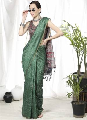 Garb These Party Wear Saree in Fine Colored.These Saree And Blouse is Fabricated On Linen.Its Beautified With Bandhani Printed Designer.