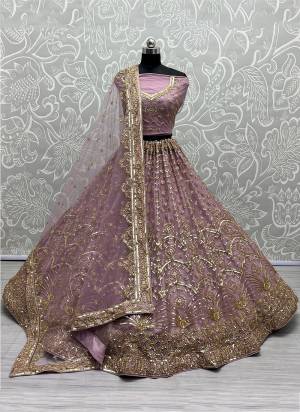 For A Designer Look,Grab These Lehenga Choli With Dupatta in Fine Colored.These Lehenga And Choli Are Bridal Net And Dupatta Are Fabricated On Soft Net Pair.Its Beautified With Designer Fancy Multy Thread,Sequance Embroidery With Hand Work.