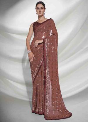 Grab These Party Wear Saree in Fine Colored.These Saree is Fabricated On Georgette Pair With Art Silk Blouse.Its Beautified With Heavy Sequance Embroidery Work.