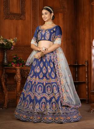 For A Designer Look,Grab These Lehenga Choli in Fine Colored.These Lehenga Choli Are Taffeta Silk And Dupatta Are Fabricated On Net Pair.Its Beautified With Fancy Designer Thread Embroidery Work.