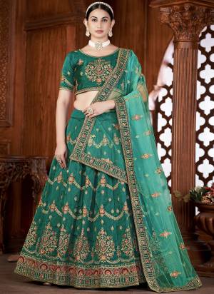 For A Designer Look,Grab These Lehenga Choli in Fine Colored.These Lehenga Choli Are Taffeta Silk And Dupatta Are Fabricated On Net Pair.Its Beautified With Fancy Designer Thread Embroidery Work.