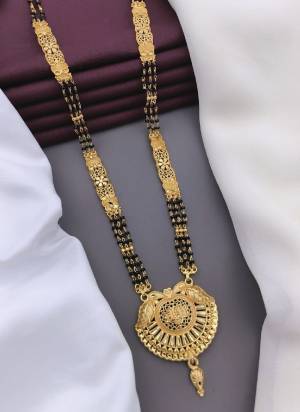 Grab These Beautifil Golden Colored Mangalsutra.These Earring is Come Mazzak Material And Beautified With Temple Work.