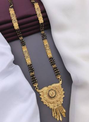 Grab These Beautifil Golden Colored Mangalsutra.These Earring is Come Mazzak Material And Beautified With Temple Work.