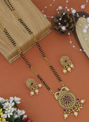 Grab These Beautifil Golden Colored Mangalsutra.These Earring is Come Mazzak Material And Beautified With Temple Work.