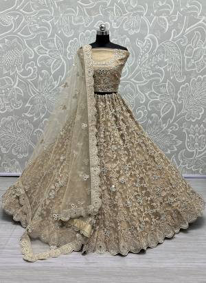 For A Designer Look,Grab These Lehenga Choli With Dupatta in Fine Colored.These Lehenga And Choli Are Bridal Net And Dupatta Are Fabricated On Soft Net Pair.Its Beautified With Designer Fancy Multy Thread,Dori,Mirror Embroidery,Diamond Work.