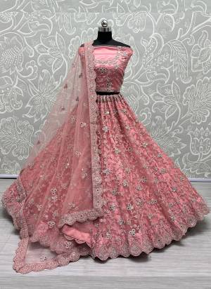 For A Designer Look,Grab These Lehenga Choli With Dupatta in Fine Colored.These Lehenga And Choli Are Bridal Net And Dupatta Are Fabricated On Soft Net Pair.Its Beautified With Designer Fancy Multy Thread,Dori,Mirror Embroidery,Diamond Work.