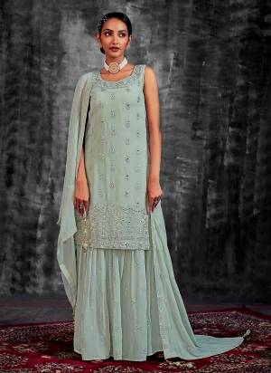 Garb These Readymade Sharara Suit in Fine Colored Pair With Bottom And Dupatta.These Top Are Georgette And Dupatta Are Fabricated On Georgette Pair With Georgette Bottom.Its Beautified With Heavy Designer Mirror,Thread,Jari Embroidery With Zarkan Work.