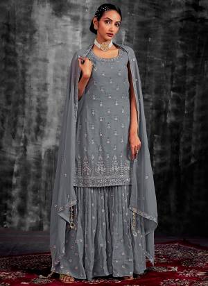 Garb These Readymade Sharara Suit in Fine Colored Pair With Bottom And Dupatta.These Top Are Georgette And Dupatta Are Fabricated On Georgette Pair With Georgette Bottom.Its Beautified With Heavy Designer Mirror,Thread,Jari Embroidery With Zarkan Work.