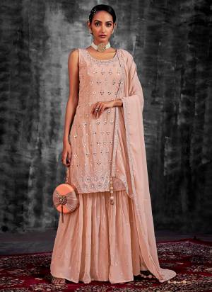 Garb These Readymade Sharara Suit in Fine Colored Pair With Bottom And Dupatta.These Top Are Georgette And Dupatta Are Fabricated On Georgette Pair With Georgette Bottom.Its Beautified With Heavy Designer Mirror,Thread,Jari Embroidery With Zarkan Work.