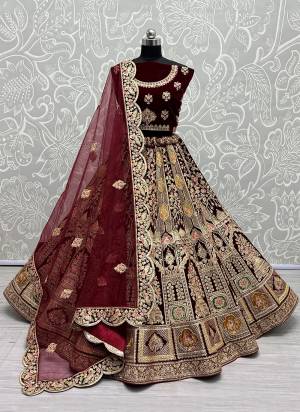 For A Designer Look,Grab These Lehenga Choli With Dupatta in Fine Colored.These Lehenga And Choli Are Velvet And Dupatta Are Fabricated On Soft Net Pair.Its Beautified With Designer Fancy Multy Thread,Dori Embroidery,Zarkan Diamond Work.