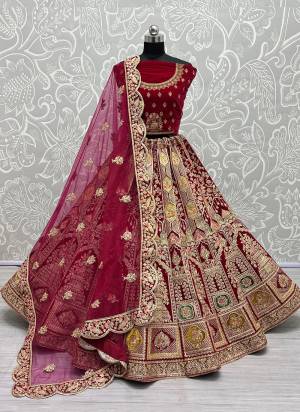 For A Designer Look,Grab These Lehenga Choli With Dupatta in Fine Colored.These Lehenga And Choli Are Velvet And Dupatta Are Fabricated On Soft Net Pair.Its Beautified With Designer Fancy Multy Thread,Dori Embroidery,Zarkan Diamond Work.