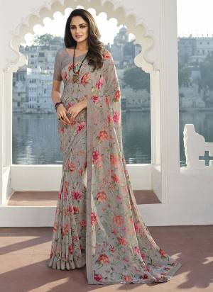 Garb These Party Wear Saree in Fine Colored.These Saree Are Georgette And Blouse is Fabricated On Banglori.Its Beautified With Designer Floral Printed With Lace Border.