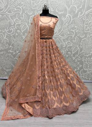 For A Designer Look,Grab These Lehenga Choli With Dupatta in Fine Colored.These Lehenga And Choli Are Bridal Net And Dupatta Are Fabricated On Soft Net Pair.Its Beautified With Designer Fancy Multy Thread,Dori Embroidery,Heavy Zarkan Diamond Work.