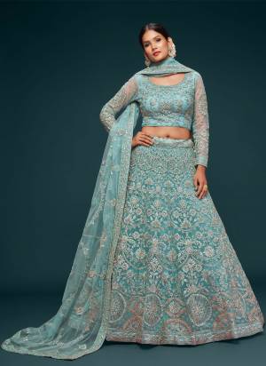 For A Designer Look,Grab These Lehenga Choli in Fine Colored.These Lehenga And Dupatta Are Fabricated On Soft Net Pair With Soft Net Blouse.Its Beautified With Designer Thread,Jari,Dori,Badla Embroidery Work.