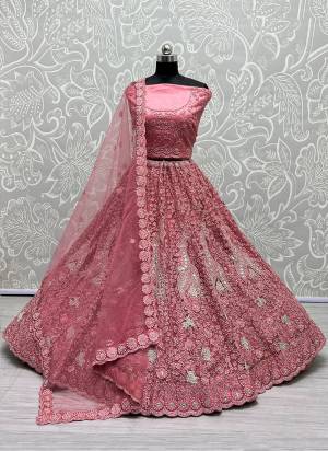 For A Fancy Designer Look,Grab These Lehenga Choli With Dupatta in Fine Colored.These Lehenga And Choli Are Bridal Net And Dupatta Are Fabricated On Soft Net Pair.Its Beautified With Designer Fancy Multy Thread,Mirror,Dori Embroidery,Diamond Work.