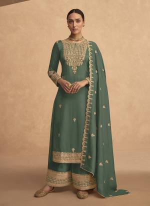 Garb These Designer Plazzo Suits in Fine Colored Pair With Dupatta.These Top Are Georgette And Dupatta Are Fabricated On Georgette Pair With Georgette Bottom.Its Beautified With Heavy Designer Sequance,Jari Embroidery Work.