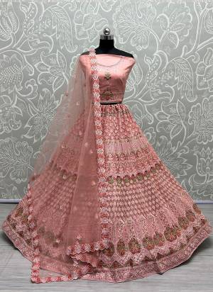 For A Fancy Designer Look,Grab These Lehenga Choli With Dupatta in Fine Colored.These Lehenga And Choli Are Heavy Net And Dupatta Are Fabricated On Soft Net Pair.Its Beautified With Designer Fancy Multy Thread,Jari Embroidery,Diamond Work.