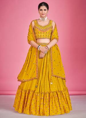 For A Designer Look,Grab These Lehenga Choli in Fine Colored.These Lehenga And Blouse Are Fabricated On Georgette Pair With Georgette Dupatta.Its Beautified With Thread,Mirror Embroidery Work.