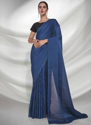 Grab These Party Wear Saree in Fine Colored.These Saree is Fabricated On Georgette Pair With Art Silk Blouse.Its Beautified With Heavy Crush, Sequance Embroidery Work.