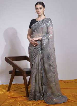 Attrective Look These Saree in Fine Colored.These Saree Are Georgette And Blouse is Mono Banglori Fabricated.Its Beautified With Designer Sequance Embroidery Work.