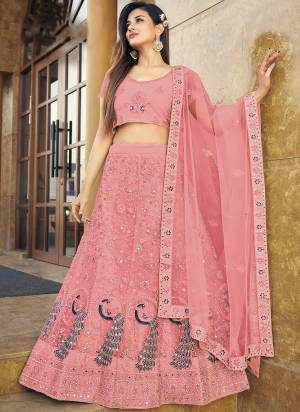 Garb This Partywear Fine Color Heavy Designer Lehemga Choli Fabric Are Soft Net And And Dupatta Soft Net In Fabricated Beautified With Attrective Reaham,Real Mirror Embroidery,Diamond Work. Buy Now.