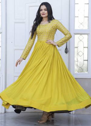 Garb These Beautiful Looking Readymade Gown.These Gown is Fabricated On Faux Georgette.Its Beautified With Designer Sequance,Jari Embroidery Work.