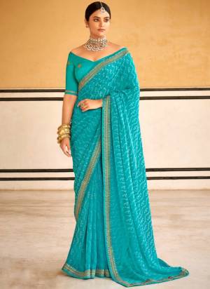 Look These Saree in Fine Colored.These Saree Are Georgette And Blouse is Fabricated On Dupion Pair.Its Beautified With Designer Bandhni Printed With Embroidery Work Lace Border Blouse.