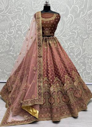 For A Fancy Designer Look,Grab These Lehenga Choli With Dupatta in Fine Colored.These Lehenga And Choli Are Bridal Net And Dupatta Are Fabricated On Soft Net Pair.Its Beautified With Designer Fancy Multy Thread,Sequance,Dori Embroidery,Diamond Work.