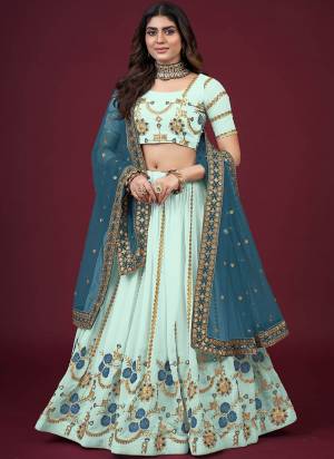 For A Designer Look,Grab These Lehenga Choli in Fine Colored.These Lehenga And Blouse Are Fabricated On Faux Georgette Pair With Butterfly Net Blouse.Its Beautified With Designer Thread,Jari,Sequance Embroidery Work.