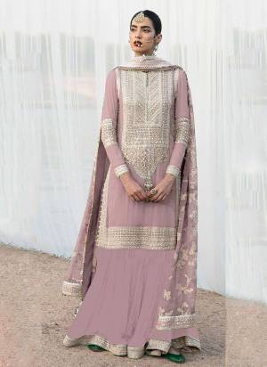 Attrective These Designer Suit in Fine Colored Pair With Bottom And Dupatta.These Top Are Faux Georgette And Dupatta Are Fabricated On Nazmin Pair With Faux Georgette Bottom.Its Beautified With Santoon Inner.Its Beautified With Heavy Designer Embroidery Work.