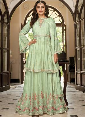 Attrective These Sharara Suit in Fine Colored Pair With Free Size Stiched Bottom And Dupatta.These Top And Bottom Are Fabricated On Chinon Pair With Chinon Dupatta.Its Beautified With Santoon Inner.Its Beautified With Heavy Designer Embroidery Work.