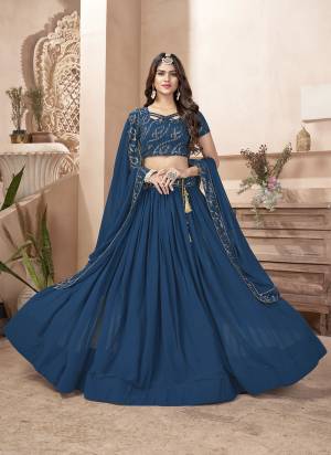 For A Designer Look,Grab These Lehenga Choli in Fine Colored.These Lehenga And Dupatta Are Fabricated On Faux Georgette Pair With Faux Georgette Blouse.Its Beautified With Designer Thread, Sequance Embroidery Work.