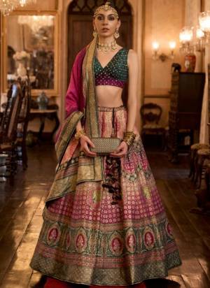 For A Fancy Designer Look,Grab These Lehenga Choli With Dupatta in Fine Colored.These Lehenga And Choli Are Rajwadi Silk And Dupatta Are Fabricated On Rajwadi Silk Pair.Its Beautified With Designer Printed With Sparkle N Aari,Mirror Embroidery Work.