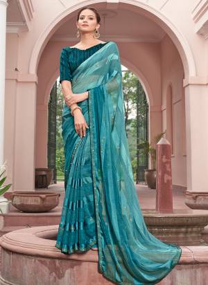 Garb These Designer Saree in Fine Colored.These Saree Are Chiffon And Blouse is Fabricated On Art Silk Pair.Its Beautified Peding Color,Wevon Satin Patta,Sequance Work.