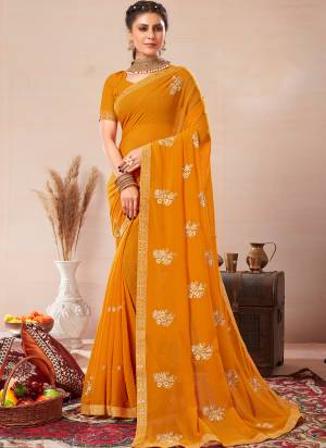 Garb These Saree in Fine Colored.These Saree Are Georgette And Blouse is Fabricated On Art Silk Pair.Its Beautified With Blooming Color With Jari Embroidery Work.