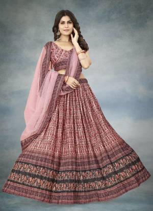 For A Designer Look,Grab These Lehenga Choli in Fine Colored.These Lehenga And Blouse Are Fabricated On Chinon Silk Pair With Net Dupatta.Its Beautified With Digital Printed With Crushed Work.