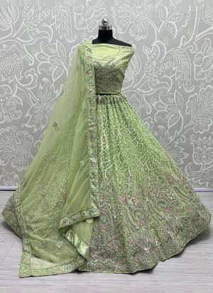 For A Fancy Designer Look,Grab These Lehenga Choli With Dupatta in Fine Colored.These Lehenga And Choli Are Bridal Net And Dupatta Are Fabricated On Soft Net Pair.Its Beautified With Designer Fancy Multy Thread,Sequance,Dori Embroidery,Diamond Work.