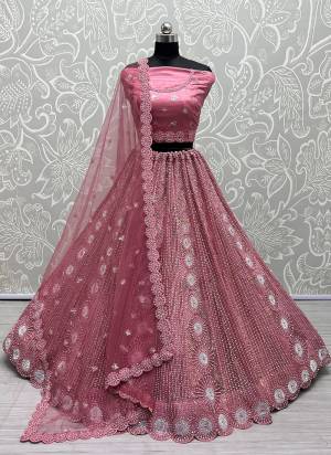 For A Fancy Heavy Designer Look,Grab These Lehenga Choli With Dupatta in Fine Colored.These Lehenga And Choli Are Net And Dupatta Are Fabricated On Soft Net Pair.Its Beautified With Designer Fancy Multy Thread, Sequance, Embroidery,Zarkan Diamond Work.